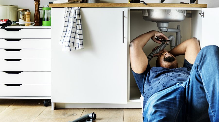 Handyman completing a plumbing repair