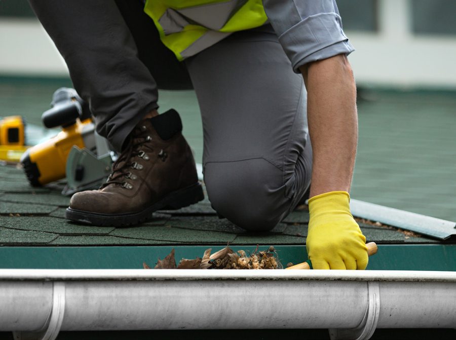Roofing contractor working safely on site